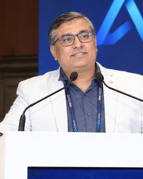 Dipender Bhamrah speaking at a podium at the India AI Advantage Summit 2026, New Delhi